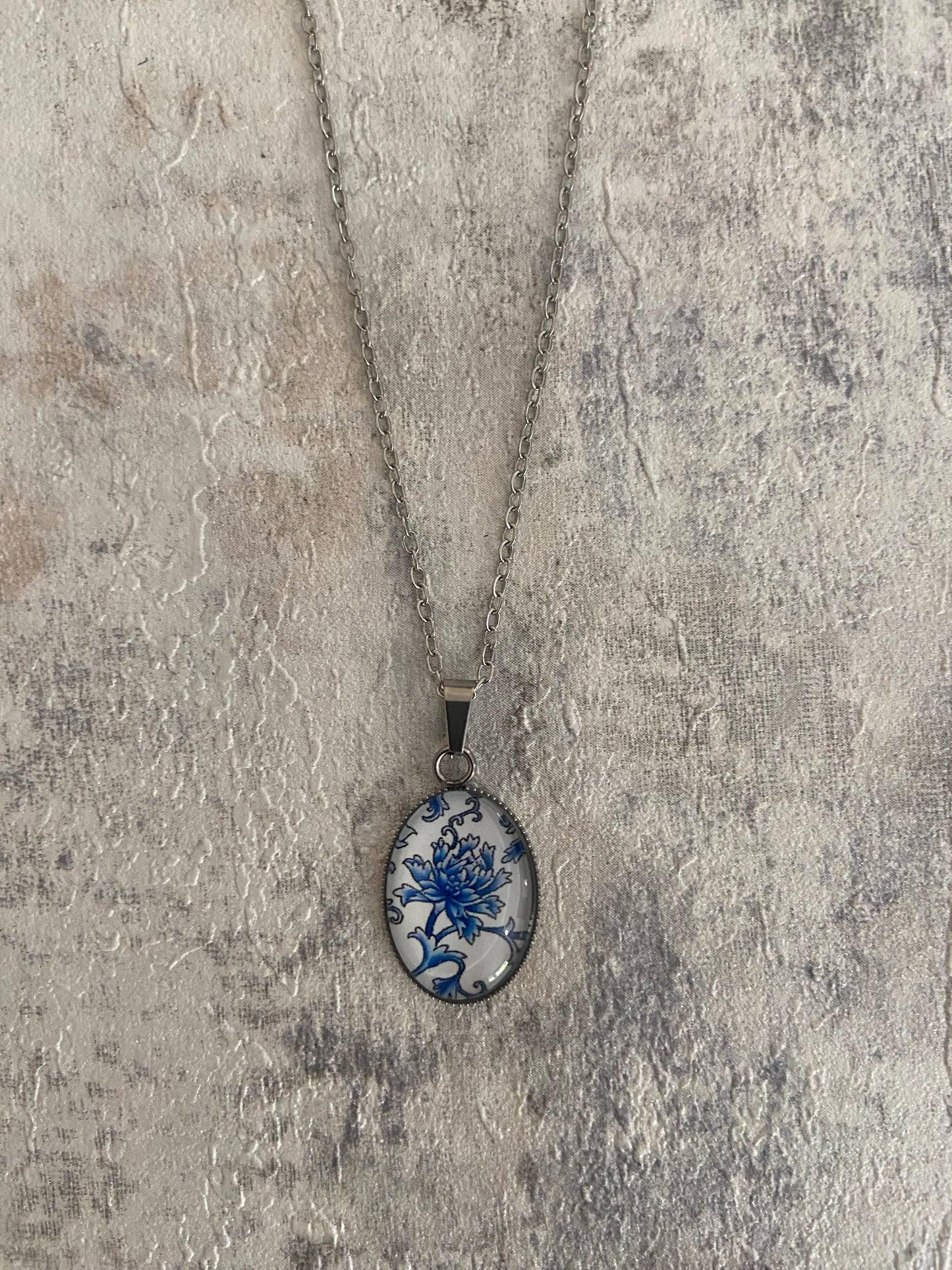 Blue/ White Floral Pattern Oval 1.8x2cm Silver Pendant Necklace (45cm chain)