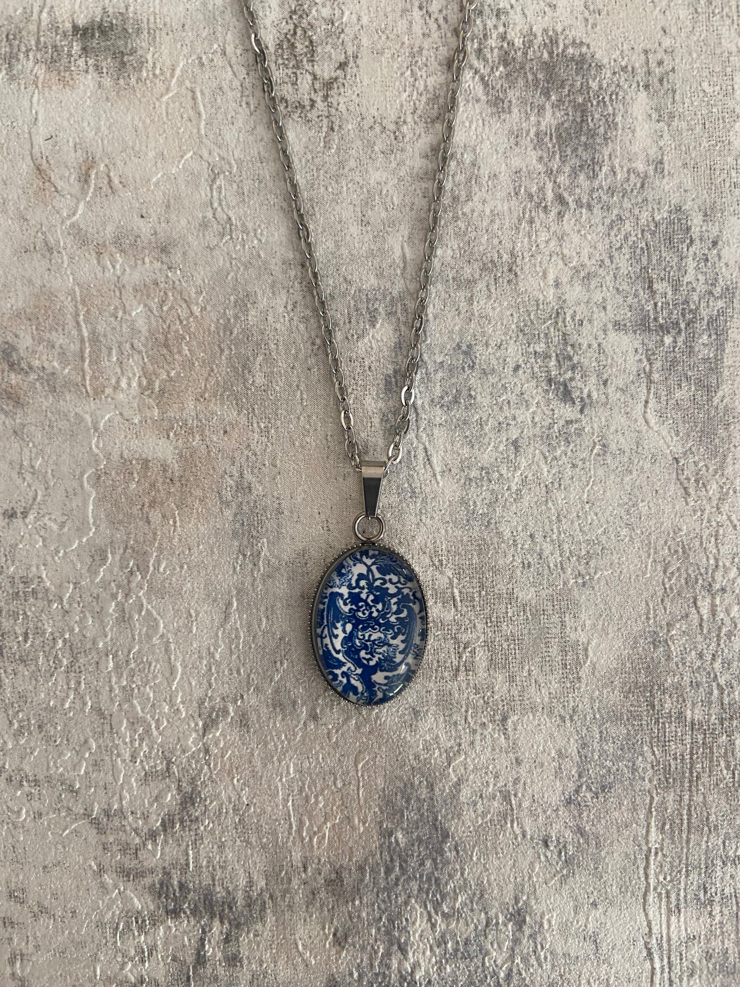 Blue/ White Floral Pattern Oval 1.8x2cm Silver Pendant Necklace (45cm chain)