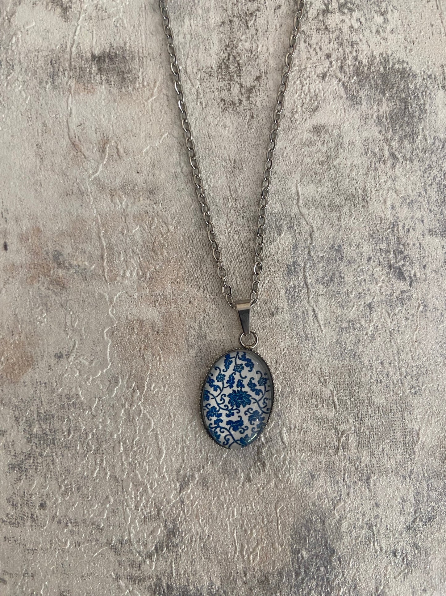 Blue/ White Floral Pattern Oval 1.8x2cm Silver Pendant Necklace (45cm chain)